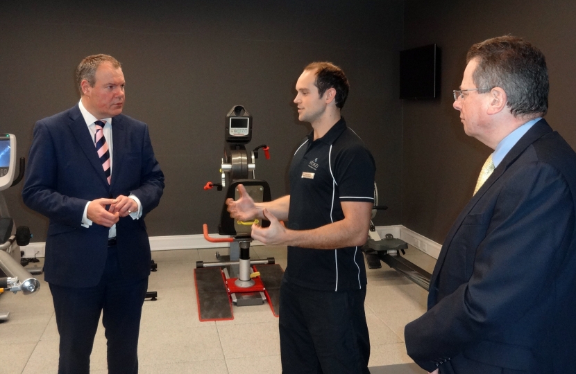 Conor Burns MP and Cllr John Beesley are shown the Hilton’s fitness suite.