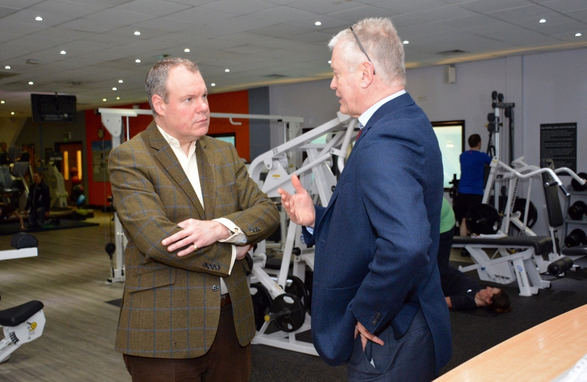 Conor Burns being show the facilities at the West Hants Club by CEO Peter Elviss
