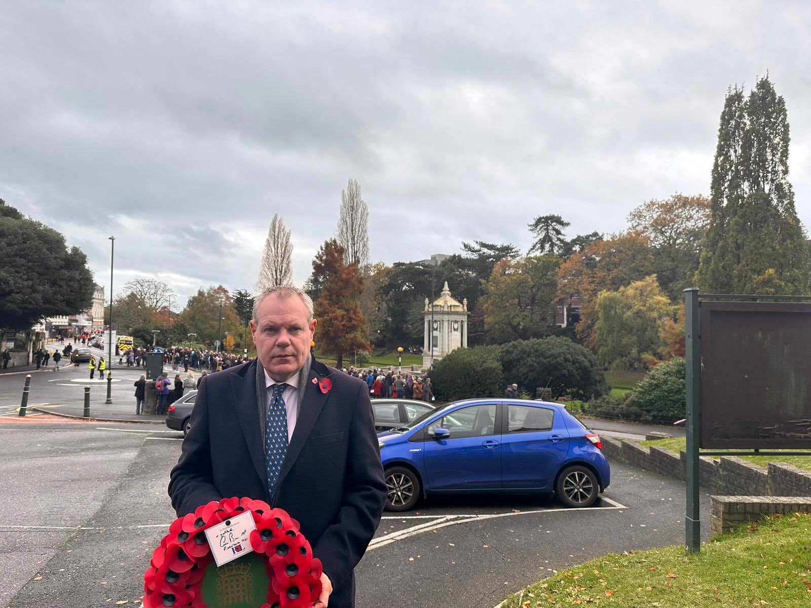 Conor holding a wreath ahead of the Remembrance parade