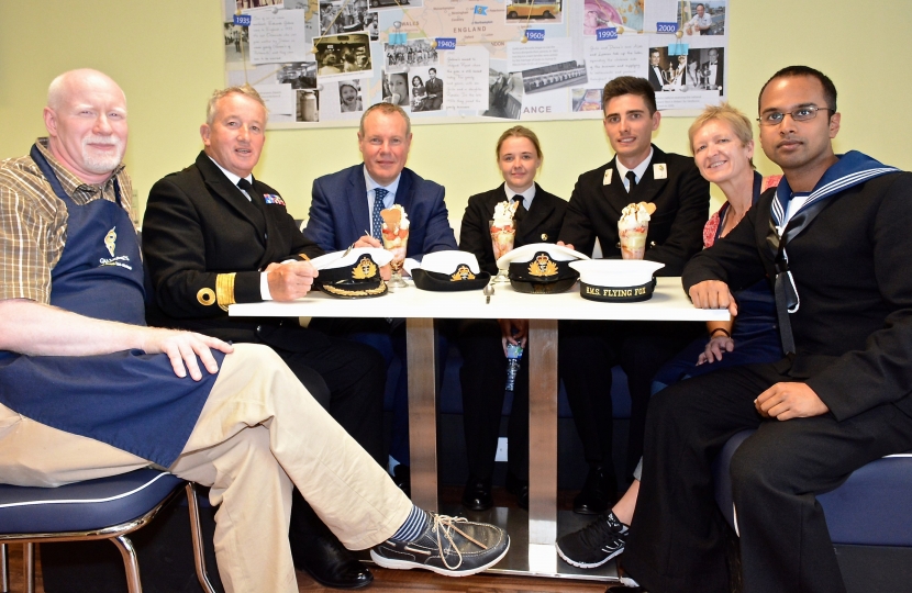 Conor with Commodore Jamie Miller CBE, Officer Cadet Amy O’Regan, AB Arun Prathapan, Rob and Liz Marsden, and the special Air Festival flavour.