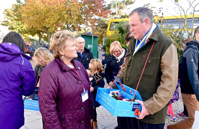 Conor chats with Councillor Anne Rey during the Poppy Collection.