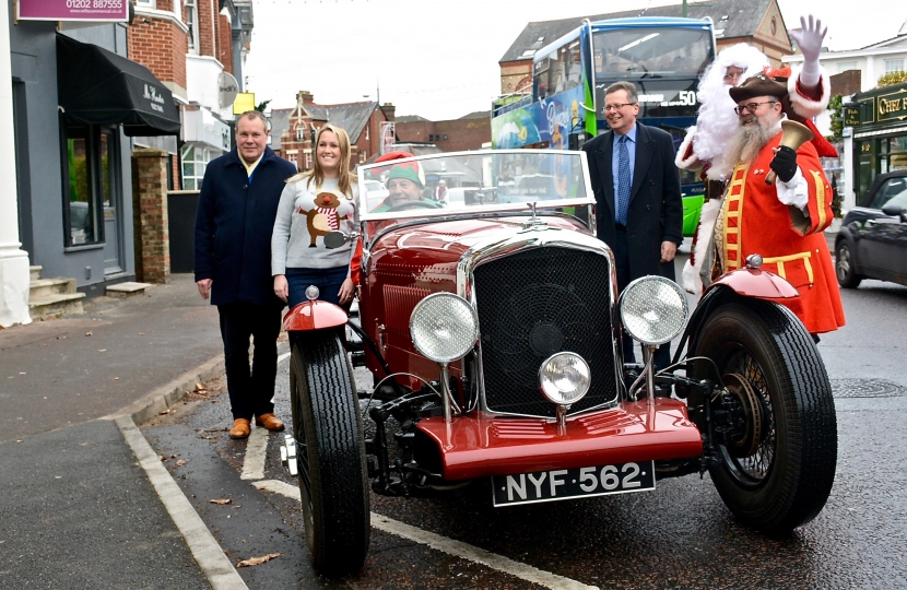 Santa arrives in an open-topped Bentley to the Westbourne Arcade.