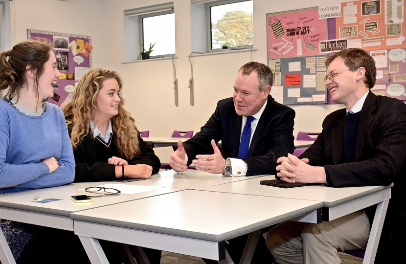 Conor and Michael Tomlinson MP in discussion with Poole's Members of the Youth Parliament Lili Donjon Mansbridge and Lowri Bradley.