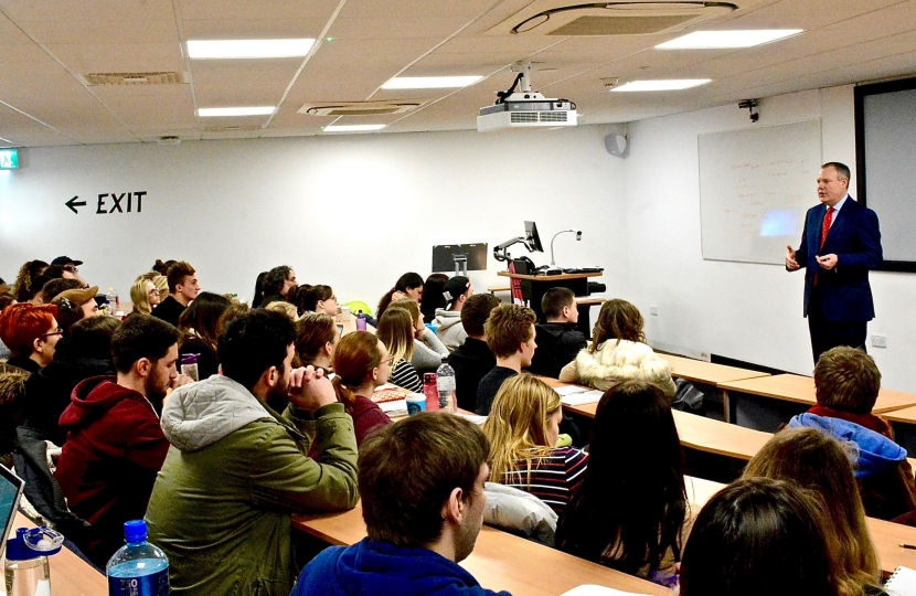 Conor delivering his lecture on tourism at Bournemouth University.