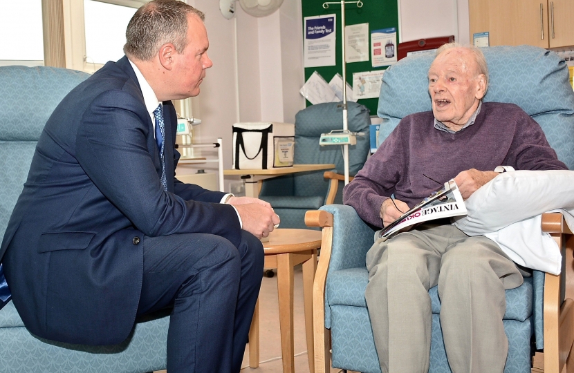 Conor pictured having a conversation with a constituent who is currently a patient at Poole Hospital.