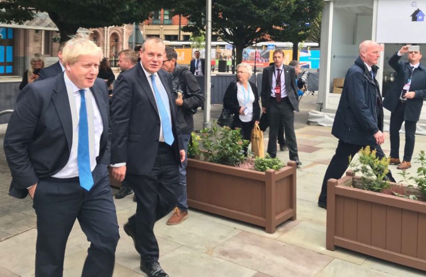Conor and Boris walk to conference centre before his speech.