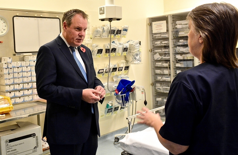 Conor pictured talking with a nurse in a RBH ward. 