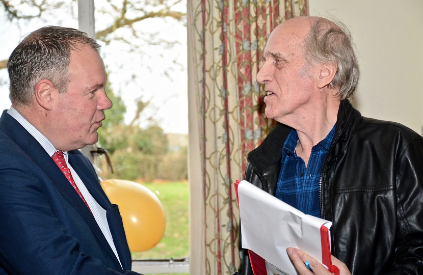 Conor pictured talking with Ray Morris, the organiser of the Kinson Community Party.