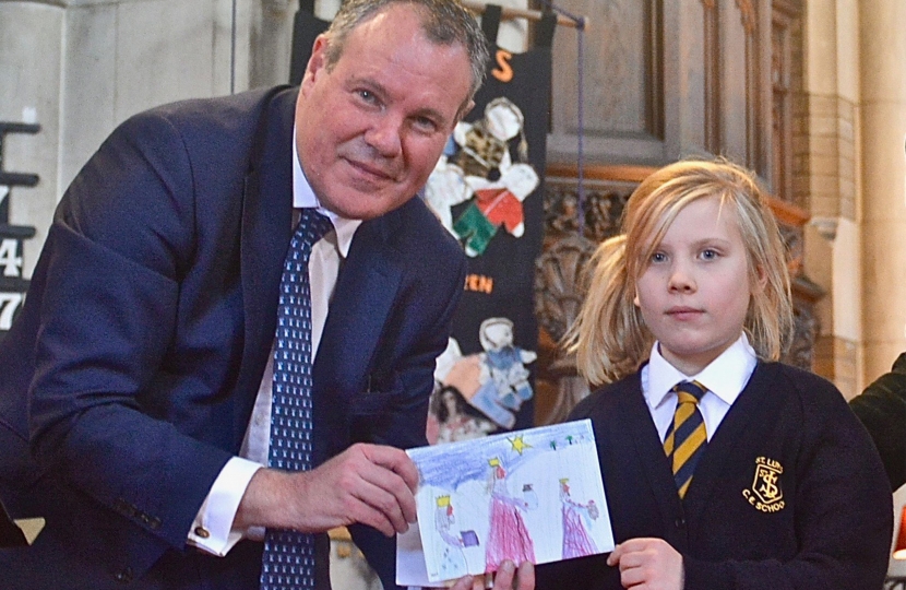 Conor pictured with Charlotte Crowe and her winning Christmas Card design.