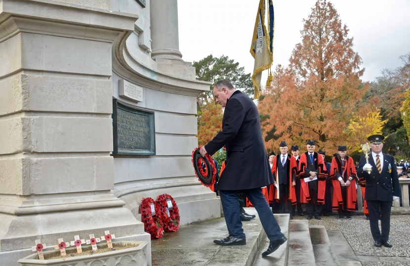 Conor lays a wreath at the war memorial on Remembrance Sunday.