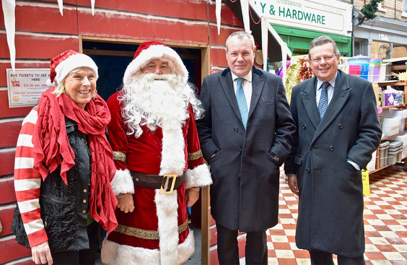 Conor in Westbourne Arcade with Council Leader John Beesley and Father Christmas.
