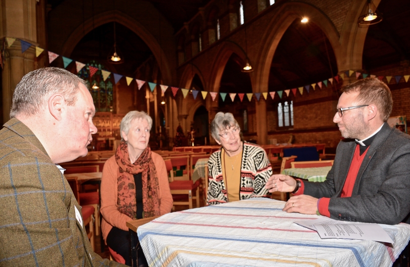 Conor chats to the Revd Michael Smith and members of the Parish Church Council.