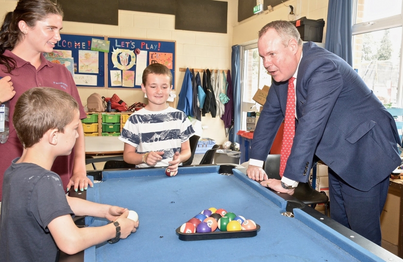 Conor chatting to some of the children who use the Fernheath Play centre over a game of pool.