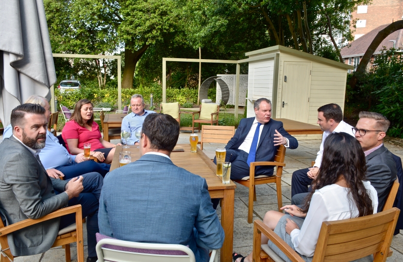 Conor speaking with local business people.