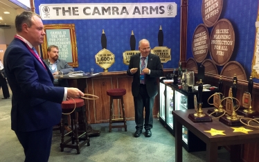 Conor playing a traditional pub game in the CAMRA Arms.