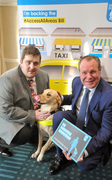 Conor with Stephen Anderson and his guide dog Barney.