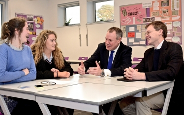 Conor and Michael Tomlinson MP in discussion with Poole's Members of the Youth Parliament Lili Donjon Mansbridge and Lowri Bradley.