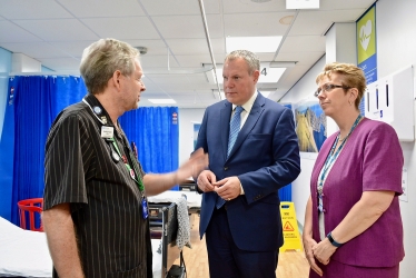 Conor pictured with a member of staff from the M.I.U Ward and Debbie Fleming, Chief Executive of Poole Hospital.