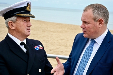 Conor pictured with Commodore Jamie Miller of the Royal Navy.