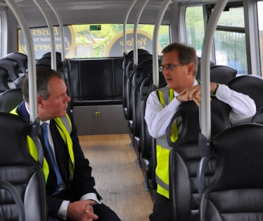 Conor pictured talking to Andrew on the top of a Yellow Buses double decker bus.