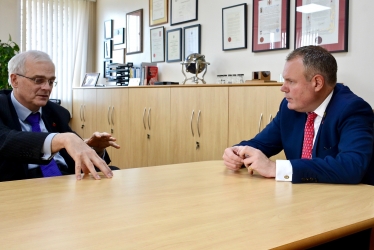 Conor pictured talking to Vice-Chancellor Sir Christopher Snowden. 