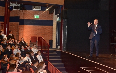 Conor pictured giving a speech to Canford School students about his role as an MP.