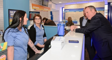 Conor pictured talking to Coral Bet shop staff about the Grand National. 