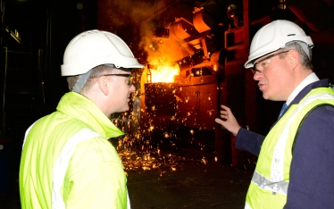 Conor watches the furnace in action during his Foundry visit.